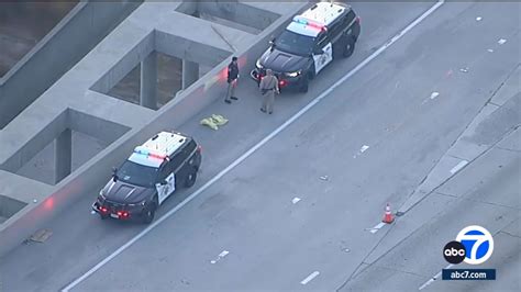 baby found dead 405 freeway|Baby's death on 405 linked to Woodland Hills homicide, .